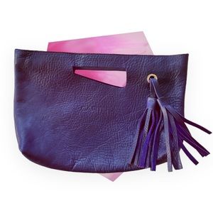 Handmade genuine leather purple Cartera handbag.